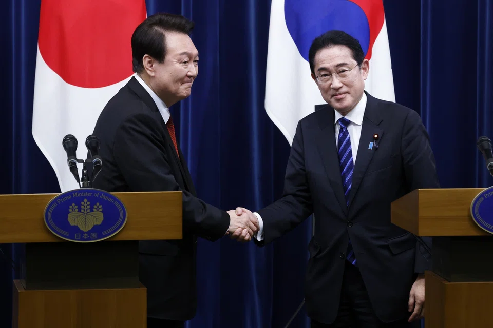 The announcement comes as South Korean President Yoon Suk-yeol (left) and Japanese Prime Minister Fumio Kishida (right) prepare for a trilateral summit with US President Joe Biden.