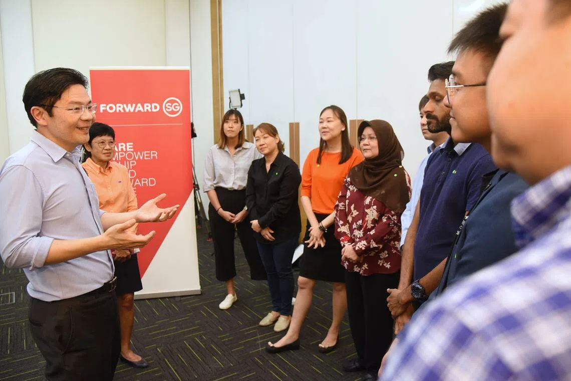 Deputy Prime Minister Lawrence Wong (extreme left), at a dialogue with social service practitioners, outlined his vision for a fairer and more inclusive society with better support for lower-income families, seniors and those starting and raising families.  