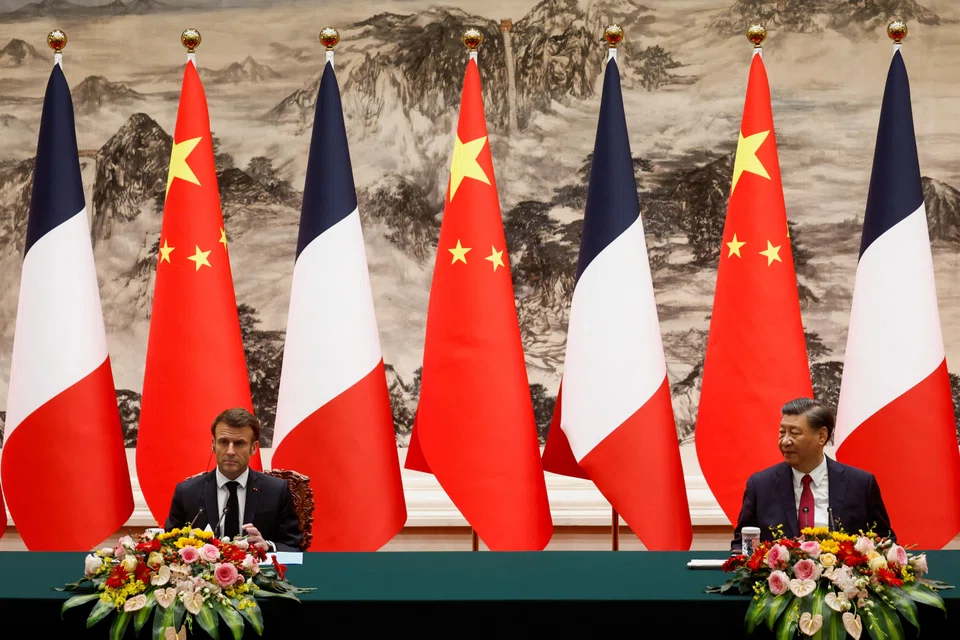 Chinese President Xi Jinping and French President Emmanuel Macron attend a signing ceremony at the Great Hall of the People in Beijing on Thursday (Apr 6).