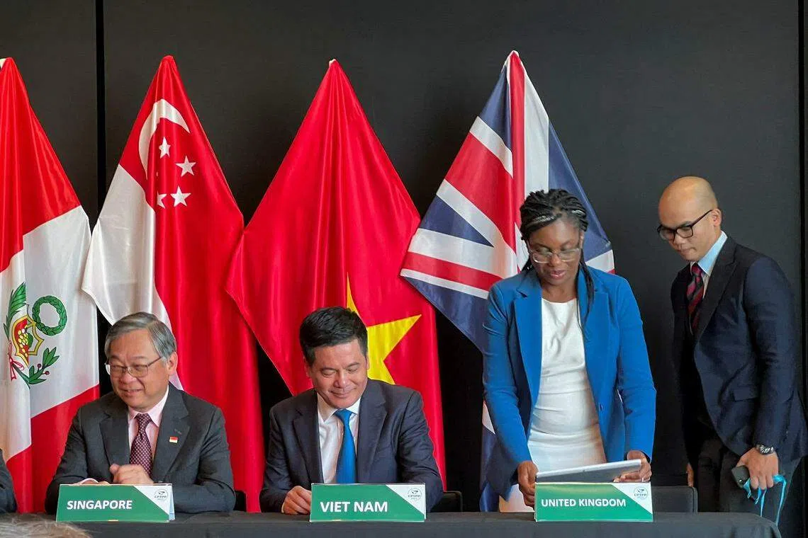 From left: Singapore Minister for Trade and Industry Gan Kim Yong, Vietnam Minister of Trade and Industry Nguyen Hong Dien and British Secretary of State for Business and Trade Kemi Badenoch in July 2023 at the signing of a treaty for the UK to join the CPTPP.