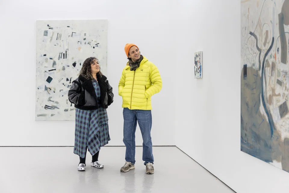 Vanessa Carlos (left), a co-founder of Carlos/Ishikawa gallery and creator of Condo, showing works by Libasse Ka.