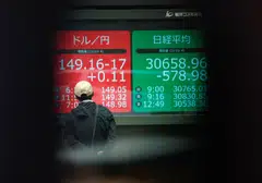 Stock markets in Asia, including Tokyo and Hong Kong , were down at mid day on Friday.