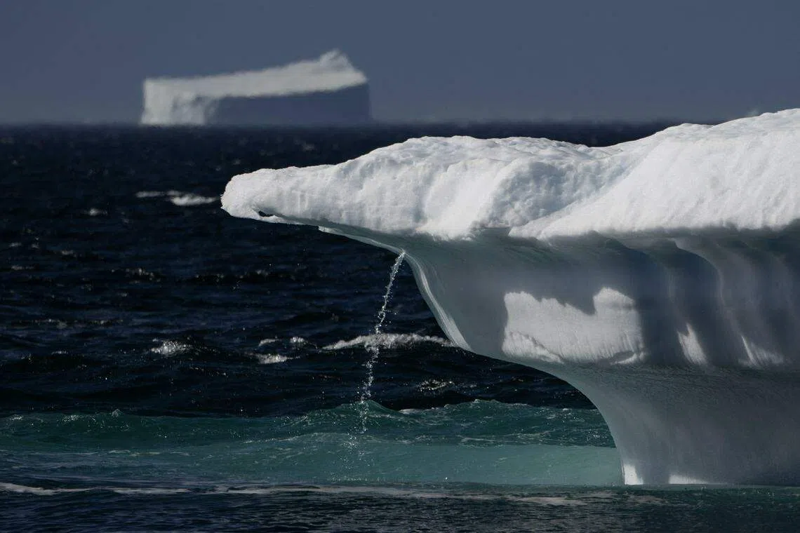 Flowing water from a melting iceberg in Scoresby Fjord, Greenland, August 12, 2023. Since 1990, melting ice in Greenland and Antarctica has slowed down the Earth’s rotation, a study found. This has delayed the need for a negative leap second until at least 2029.
