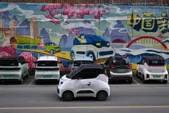 Tiny electric cars weave through traffic in southern China, their cheap and cheerful designs bringing a touch of colour to the EV revolution in the country's overlooked cities. 