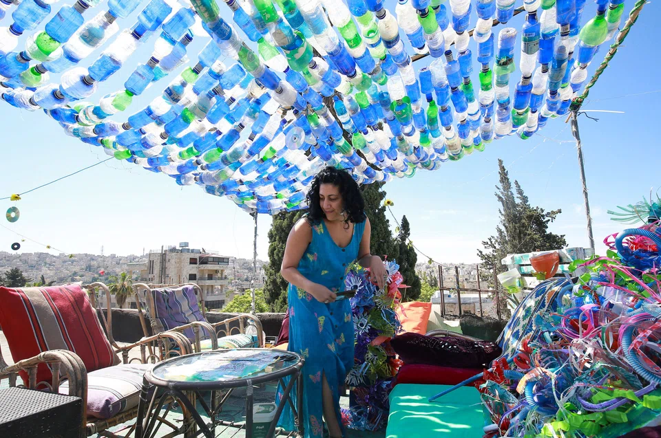 Nissan with one of her art installations created from plastic waste.
