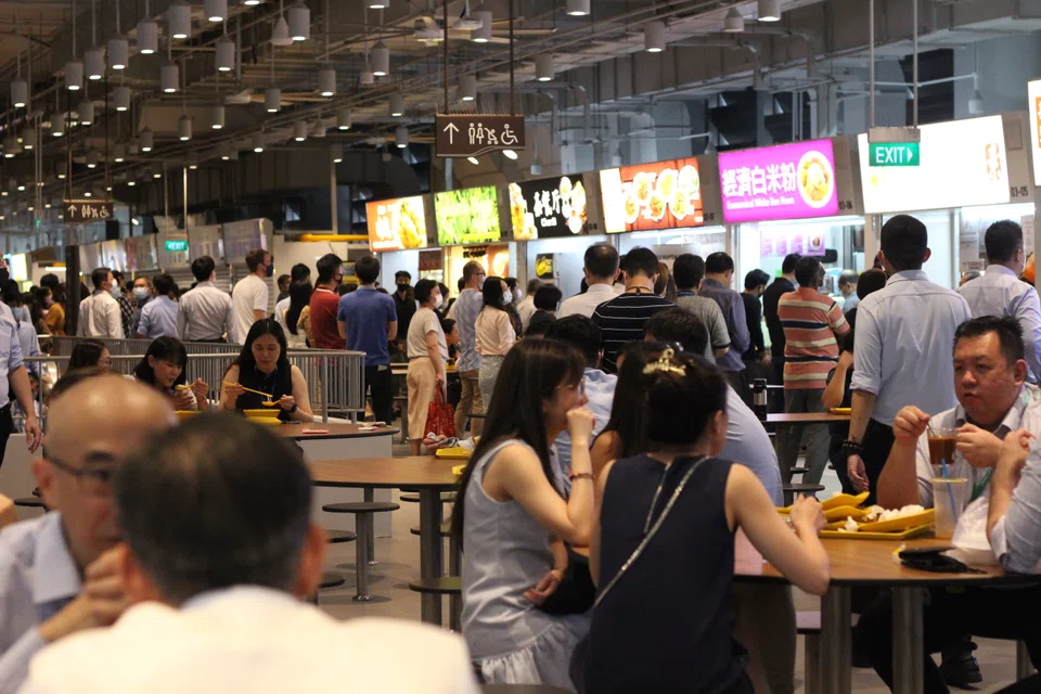 Office workers at Market Street Hawker Centre in Raffles Place during lunch hour.