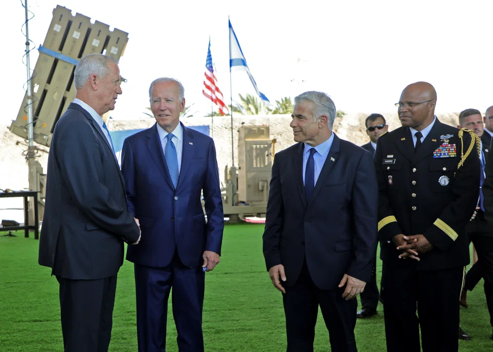 (L-R) Israel's Defence Minister Benny Gantz, US President Joe Biden, Israeli caretaker Prime Minister Yair Lapid and US Defence Attache in Israel, Brigadier General Shawn A. Harris , stand in front of Israel's Iron Dome defence system during a tour at Ben Gurion Airport near Tel Aviv, Israel, 13 July 2022. 