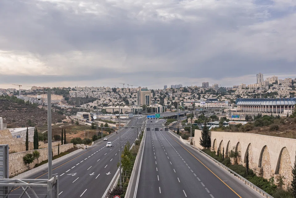 A nearly-empty highway in Jerusalem after Palestinian militants fired thousands of rockets and invaded several Israeli towns on Saturday. 