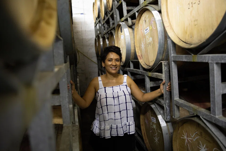 Carmen Stevens in her wine cellar in Stellenbosch, South Africa. She owns a self-titled wine brand and is believed to be the first Black person in South Africa to fully own a wine production facility.
