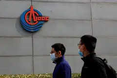 China's CNOOC Ltd saw its stock surge as much as 44 per cent in its Shanghai debut on Thursday in defiance of overall market weakness, as investors sought safety in the oil giant amid lofty energy prices and quickening inflation. 