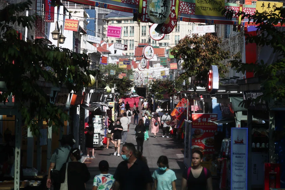 Visitors at Pagoda Street and along Chinatown in Singapore. 