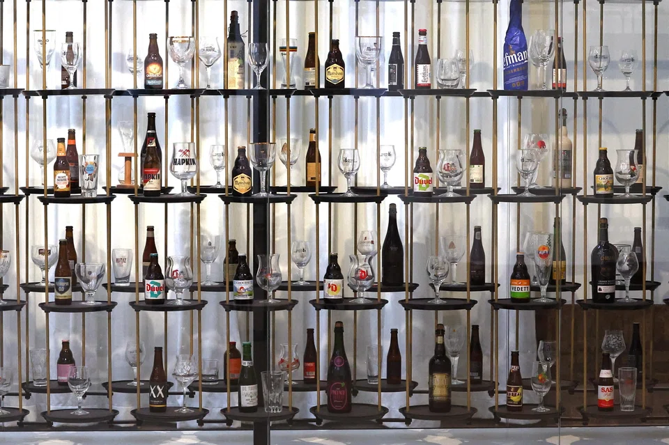 Beer bottles and glasses are displayed at the Belgian Beer World, the world's largest interactive experience center about beer.