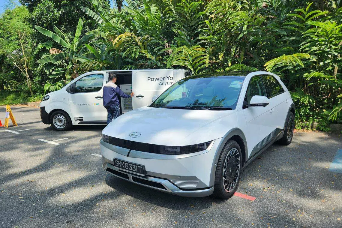 A P.Up mobile charging van (behind) and Hyundia Ioniq 5 EV (front); the P.Up charging van will provide on-location charging, topping up an EV up to 80 per cent charge. 