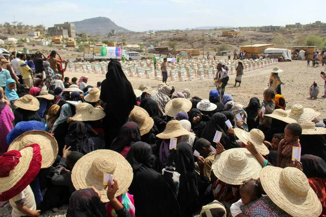 Internally displaced people wait for food aid to be distributed by a charity in Taiz, Yemen, April 8, 2022. The Group of Seven rich democracies will commit up to US$5 billion to improve global food security.