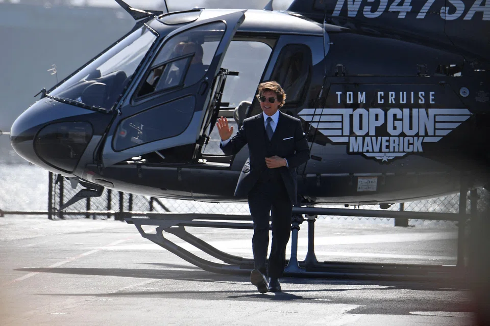 US actor Tom Cruise arrives in a helicopter to the world premiere of "Top Gun: Maverick!" in May this year. The movie is among the contenders for Golden Globe awards next month when the ceremony returns to television after a year off following a diversity and ethics scandal.