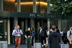 Outside the headquarters of Goldman Sachs in New York, May 25, 2022. The investment bank will let workers take as much time off as they want, but some observers see the policy as more of a cost-saving move, with no more unused vacation days and no need to pay them out later. 