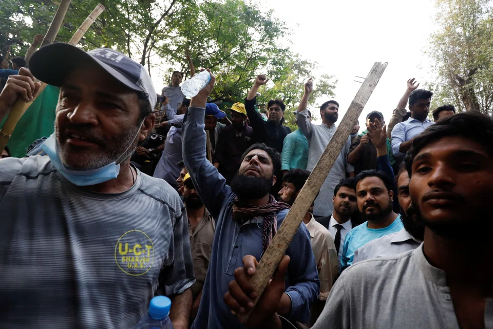 Supporters of former Pakistani Prime Minister Imran Khan. The Lahore high court ordered police to postpone the arrest Khan until Thursday.