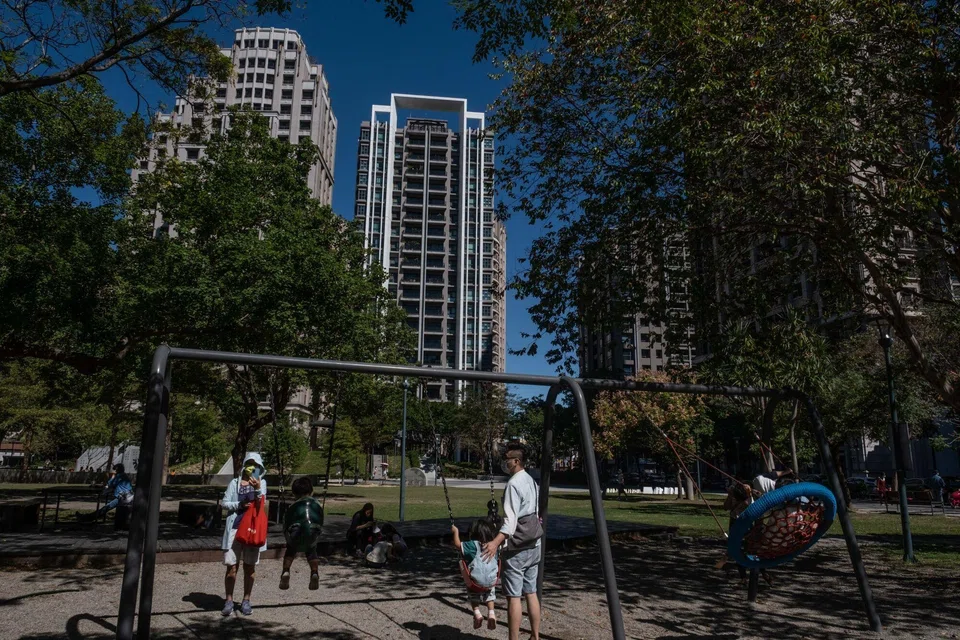 Residents at a park in front of residential buildings in the Guanxin district of Hsinchu, Taiwan. Home prices in Hsinchu have soared 99 per cent in the past five years, almost tripling the pace of Taiwan’s average.