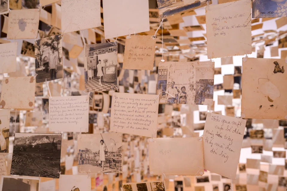 Dinh Q Le's installation features over 5,000 found photos from Vietnam, with the majority dating to the pre-Vietnam War era before 1975.
