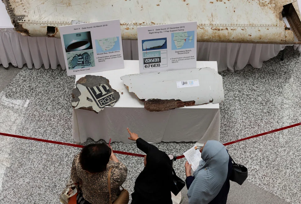 Visitors look at the wreckage of an aircraft believed to be from the missing Malaysia Airlines flight MH370 during a remembrance event marking the 10th anniversary of its disappearance, Subang Jaya, Malaysia, March 3, 2024. 