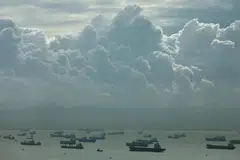 3D-printed natural gas pipes are placed on displayed EU and Russian flags in this illustration.