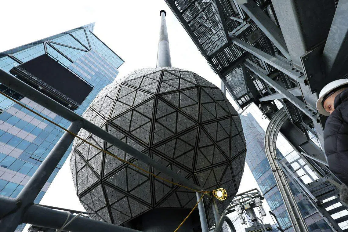Waterford crystals are installed onto the Times Square New Year's Eve celebration ball on the roof of One Times Square on Dec 27, 2022 in New York City.