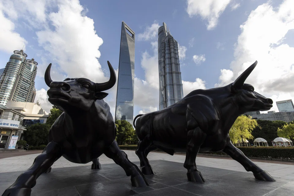 A sculpture of bulls in the Lujiazui business district in Shanghai, China. The enlarged national financial regulatory authority will absorb the country's banking and insurance watchdog and oversee the financial sector.  