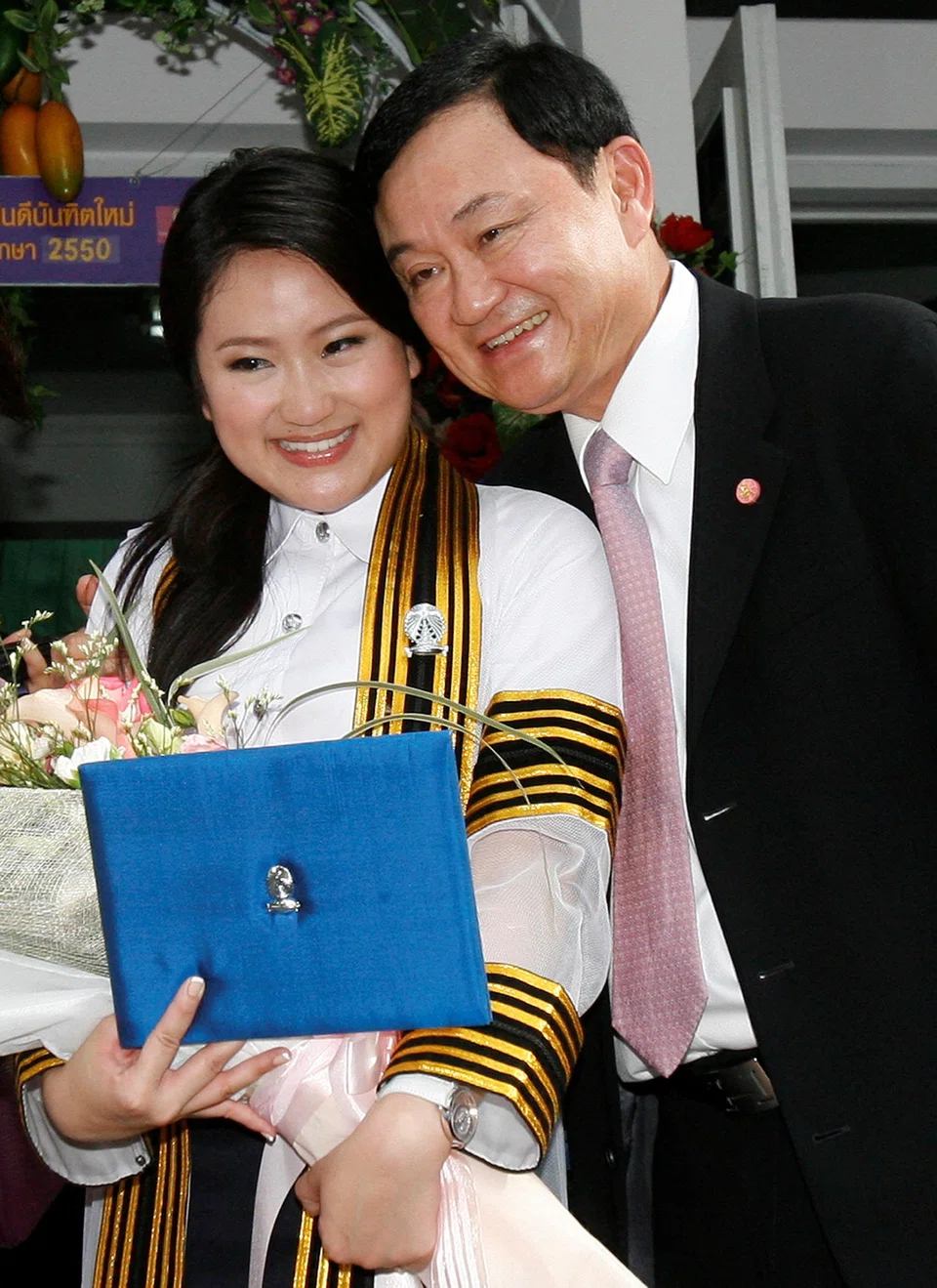 Former Thai Prime Minister Thaksin Shinawatra with his daughter Paetongtarn on her graduation day in 2008. He told Kyodo News in March that he is ready to serve his prison sentence in Thailand provided he is allowed to spend the rest of his life with his family regardless of the election result. 