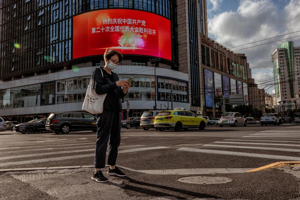 A digital billboard displaying a message celebrating the opening of the 20th National Congress of CPC in Shanghai, China.  In he meantime, the country’s vast financial bureaucracy has been busily tamping down ripples of turmoil across its currency and stock markets. 