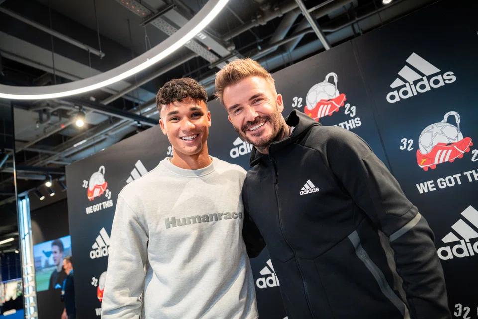 Former England captain and Manchester United midfielder David Beckham (right) with Singapore national footballer Ikhsan Fandi at the Adidas brand centre along Orchard Road on June 17, 2022.