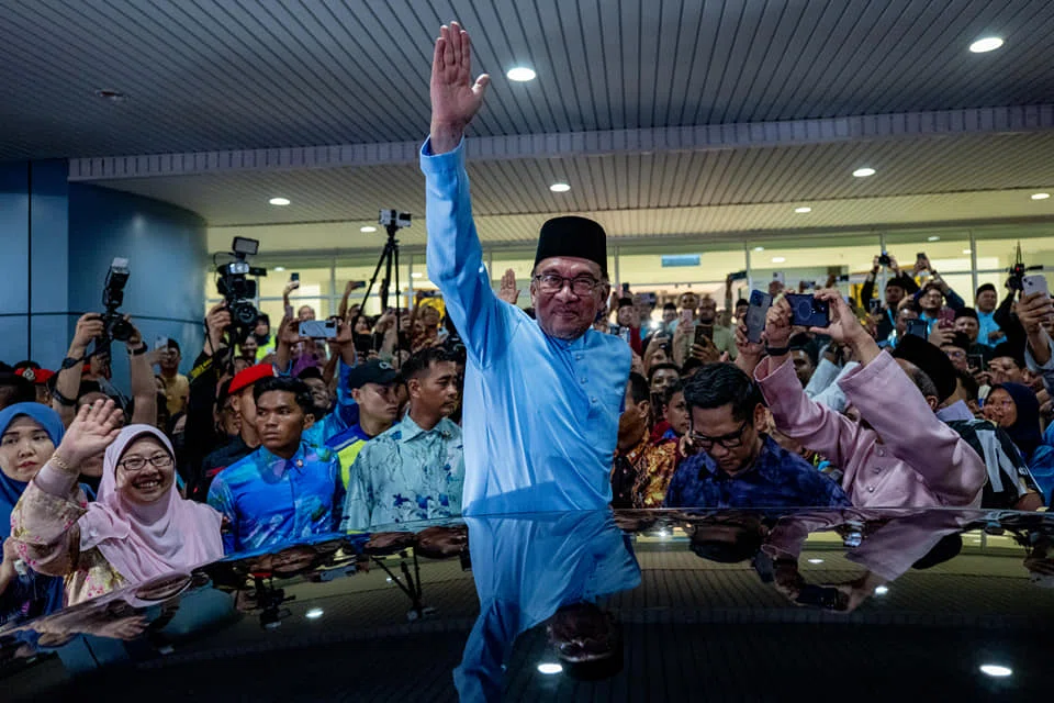 Malaysian Prime Minister Anwar Ibrahim waving to his supporters in one of the Hari Raya celebration events in Terengganu.