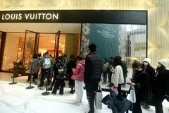 Customers line up outside a Louis Vuitton store in Hangzhou. Since 2022, the likes of Louis Vuitton and Hermes have been expanding in China's biggest cities.