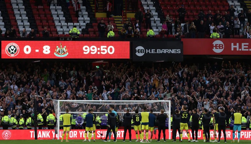 Newcastle players celebrating in front of their fans at Brammal Lane after their historic 8-0 win over Sheffield United on Sep 24. 