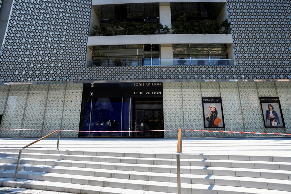 A closed store of French luxury brand Louis Vuitton is pictured during lockdown, amid the Covid-19 pandemic, in Shanghai, China, May 6, 2022.
