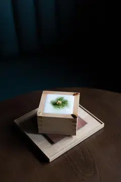 One of Mixology Salon Singapore's signature tea cocktails, Four Seams No 2 is served in a traditional wooden sake cup.