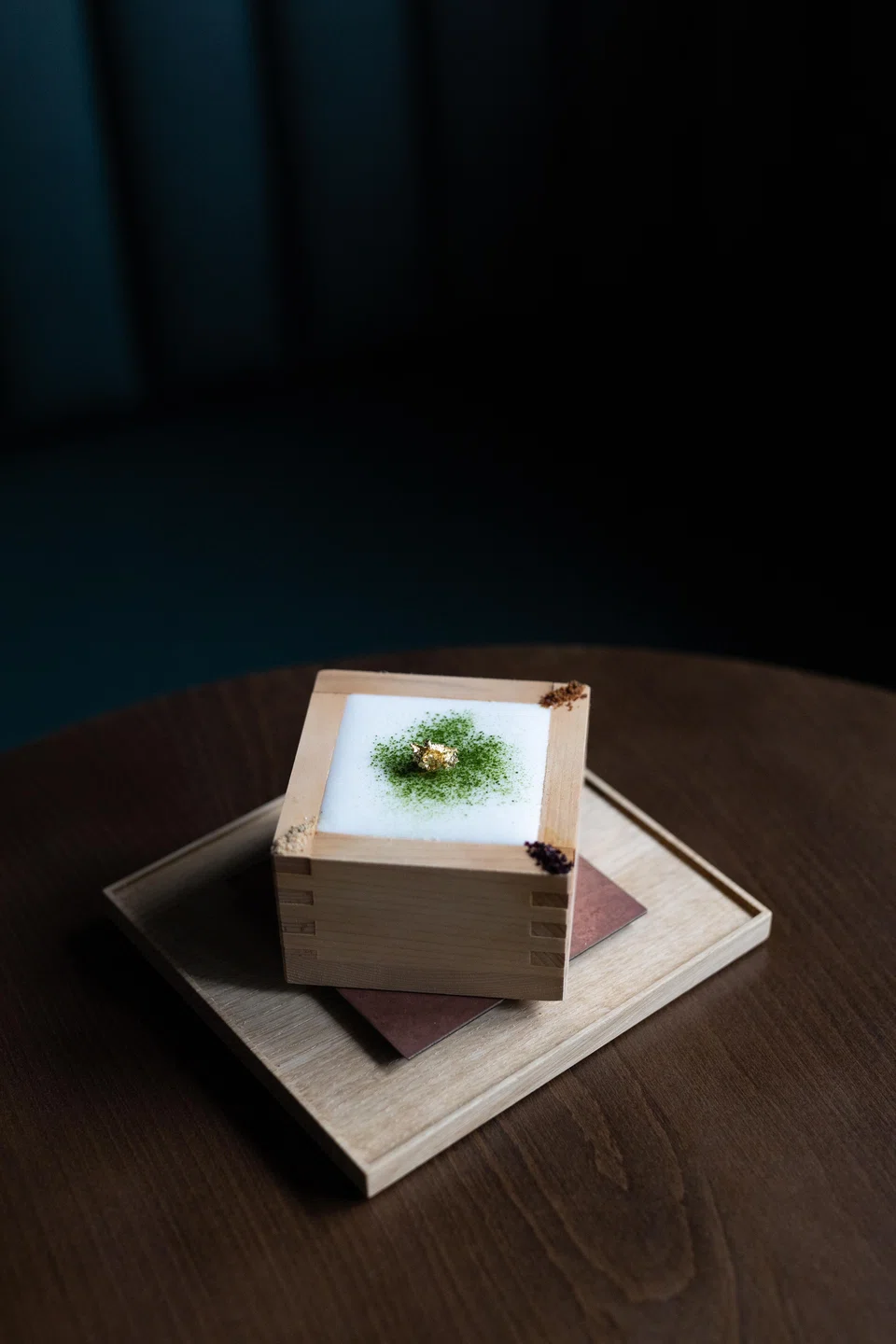 One of Mixology Salon Singapore's signature tea cocktails, Four Seams No 2 is served in a traditional wooden sake cup.