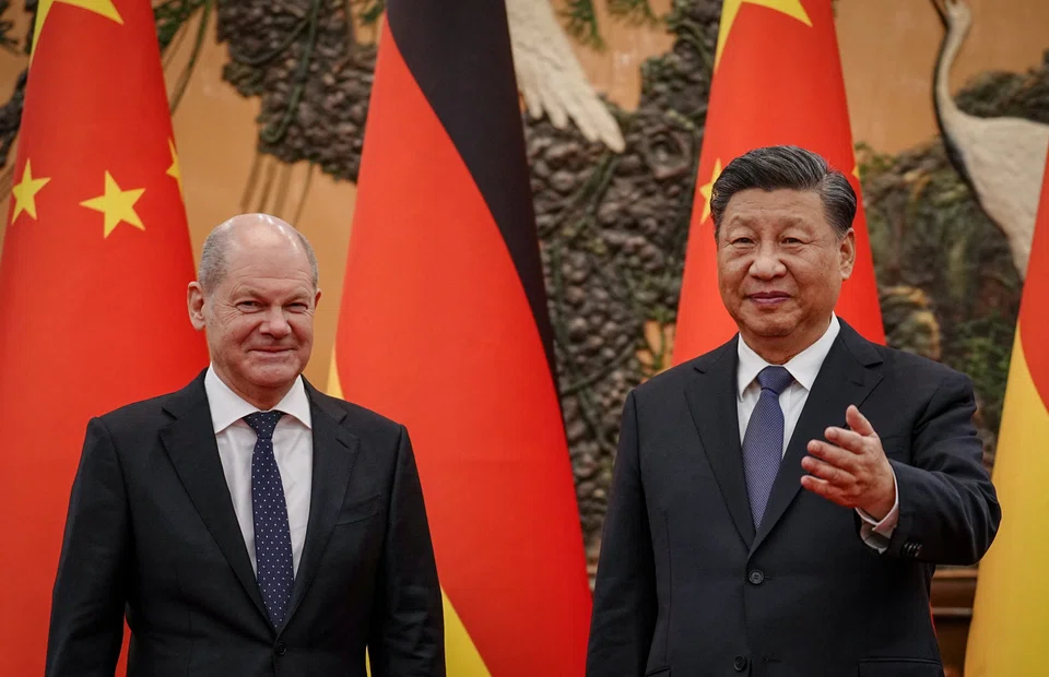German Chancellor Olaf Scholz and Chinese President Xi Jinping in Beijing on Nov 4. A document by Germany's foreign ministry is proposing measures to reduce the country's dependency on China.