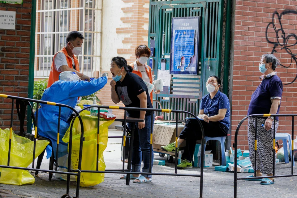 Shanghai residents will need to take nucleic acid tests at least once a week until the end of July, with workers at supermarkets, barbers, drugstores, shopping malls and restaurants required to undergo daily testing.