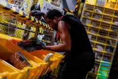 A worker selects and packs items during Cyber Monday at the Amazon fulfilment centre in New Jersey. Heavy online traffic and transactions could add up to a record US$12 billion outlay by US shoppers on Cyber Monday.