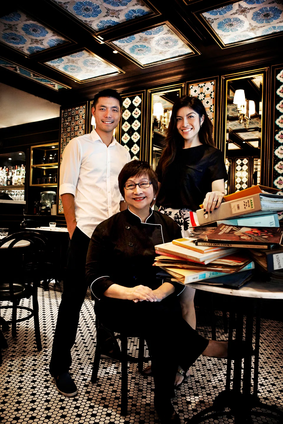 Violet Oon (seated) and her children (from left) Tay Yiming and Tay Su-Lyn. Tay Yiming alleged that business partner Manoj Murjani had verbally agreed when signing a 2014 shareholding agreement to match the family dollar for dollar whenever Violet Oon Singapore required more money. 