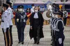 Chief Justice Andrew Cheung inspects a Ceremonial Guard mounted by the Hong Kong Police Force at the opening of the Legal Year in Hong Kong.