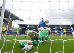 Everton's goalkeeper Jordan Pickford makes a save from Chelsea's Cesar Azpilicueta during the English Premier League soccer match between Everton FC and Chelsea FC in Liverpool, Britain.