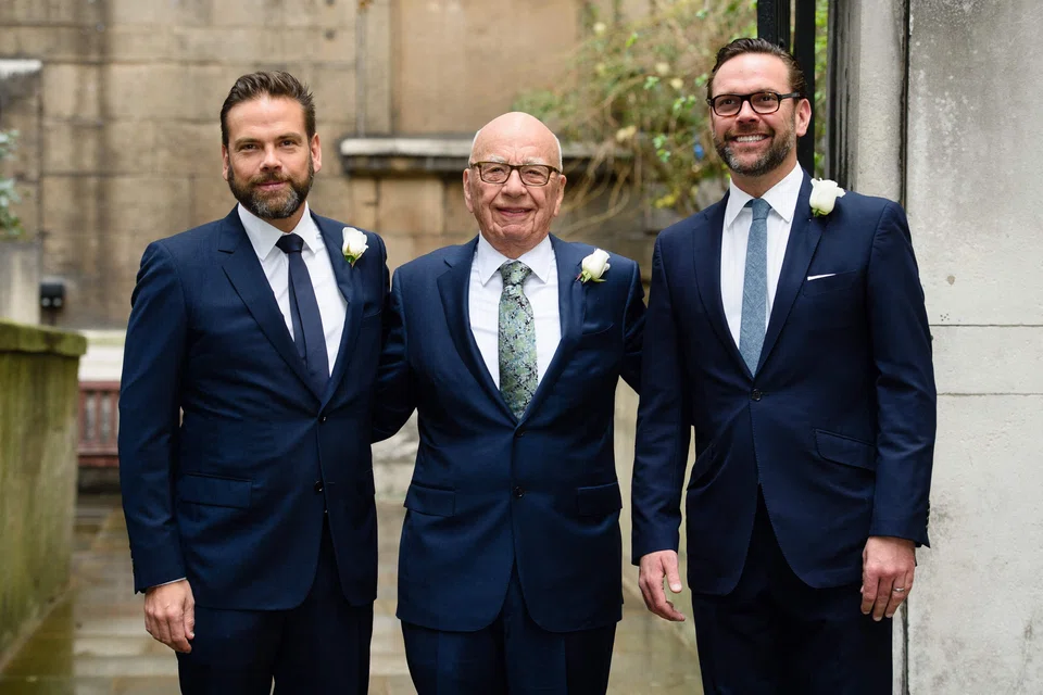 Australian-born media magnate Rupert Murdoch (centre) flanked by his sons Lachlan (left) and James (right) in a March 5, 2016 file photo. Murdoch will formally pass the baton to 52-year-old Lachlan - who is believed to share his father’s conservative leanings - at Fox Corp on Friday.