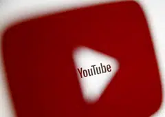 FILE PHOTO: A 3D-printed YouTube icon is seen in front of a displayed YouTube logo in this illustration taken October 25, 2017. REUTERS/Dado Ruvic/Ilustration/File Photo