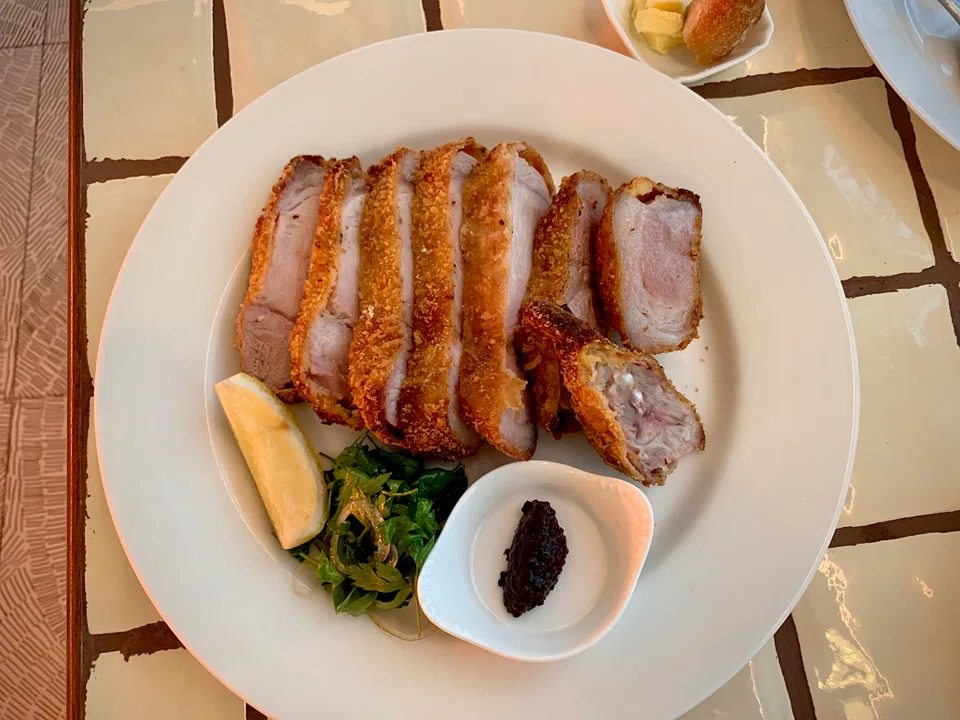 Bangalow pork chop is deep-fried for a crunchy batter and moist fatty meat.