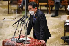 Prime Minister Fumio Kishida announces an economic stimulus package last month that includes incentives for businesses to increase wages.