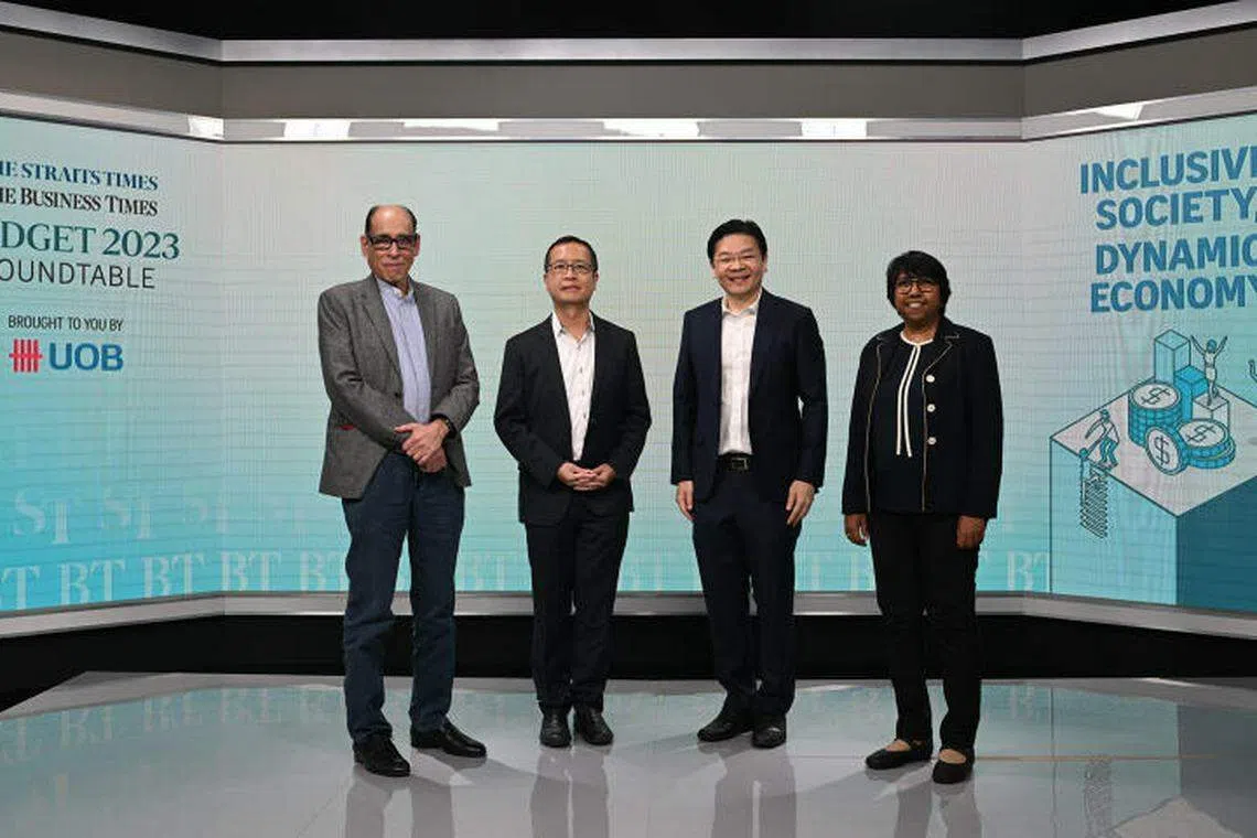 At the ST-BT Budget Roundtable 2023: From left:  Vikram Khanna, associate editor of The Straits Times, Alvin Liew, UOB senior economist, Lawrence Wong, Finance Minister and Deputy Prime Minister and K Thanaletchimi, vice-president of NTUC.