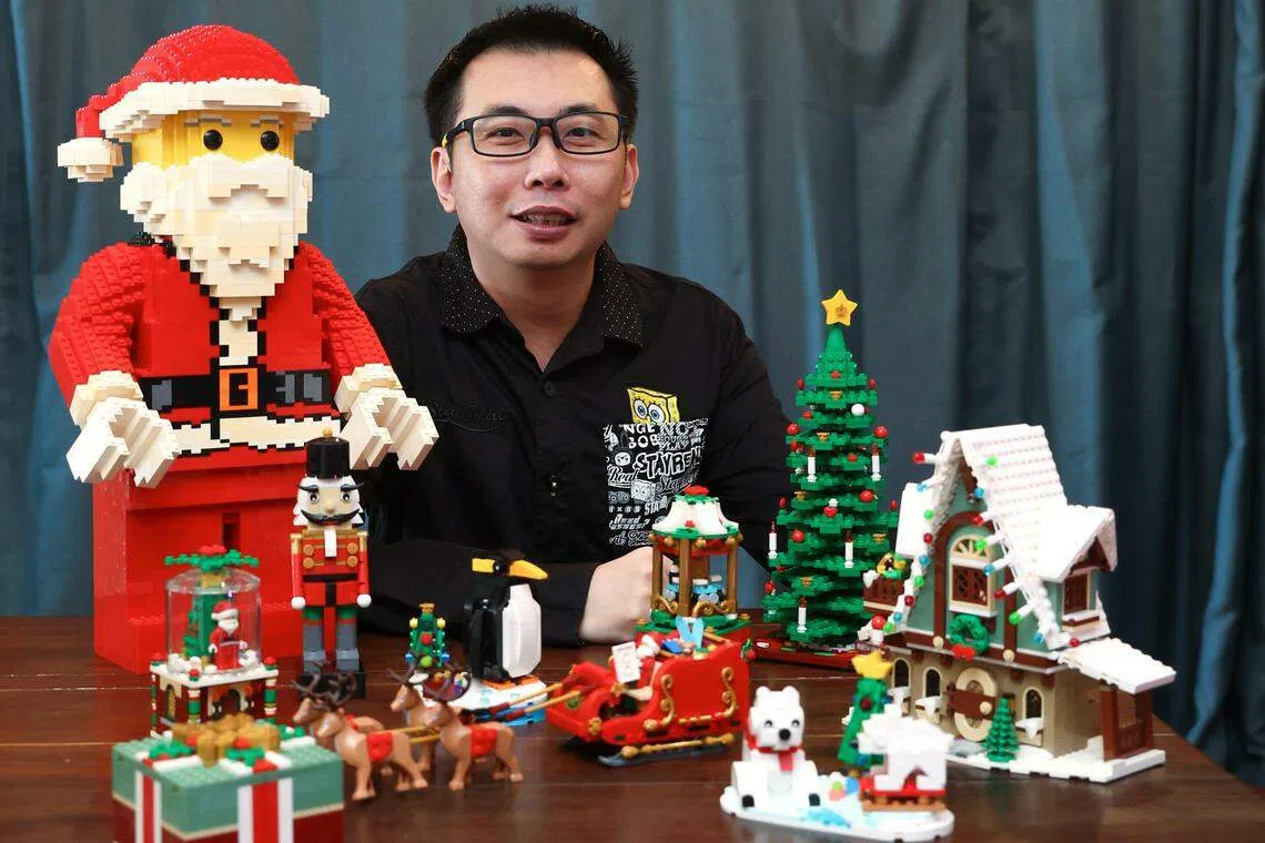 Lego collector Chun Guan Neo with his Christmas figures.