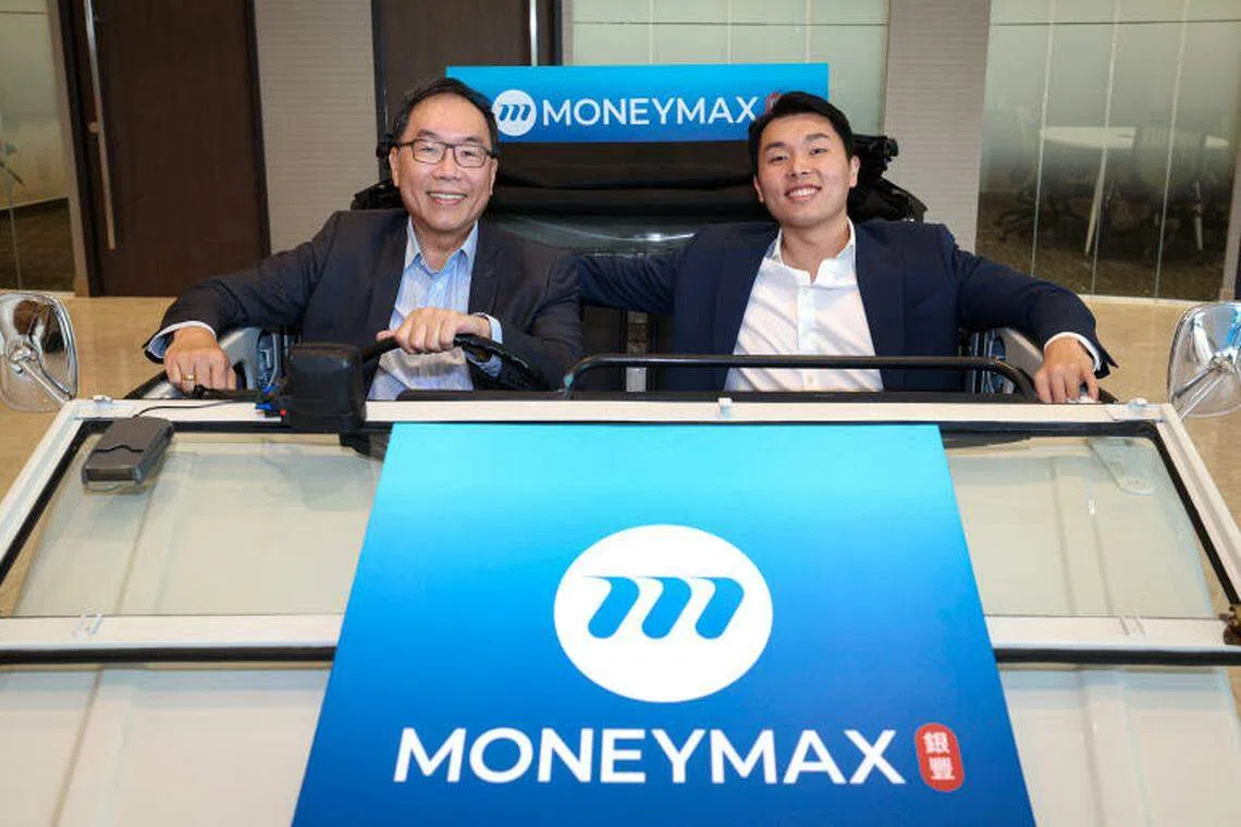 MoneyMax CEO Peter Lim (left) and his son Lim Chun Seng pose in a Volkswagen Type 181 safari vehicle, made in 1976, at the office lobby.