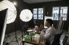 At his studio in Jakarta, Flame Media's Hank Wang directs his team to sell products on behalf of cosmetics and consumer goods makers such as L’Oreal, earning a cut and sharing the profits with the livestreaming hosts. 